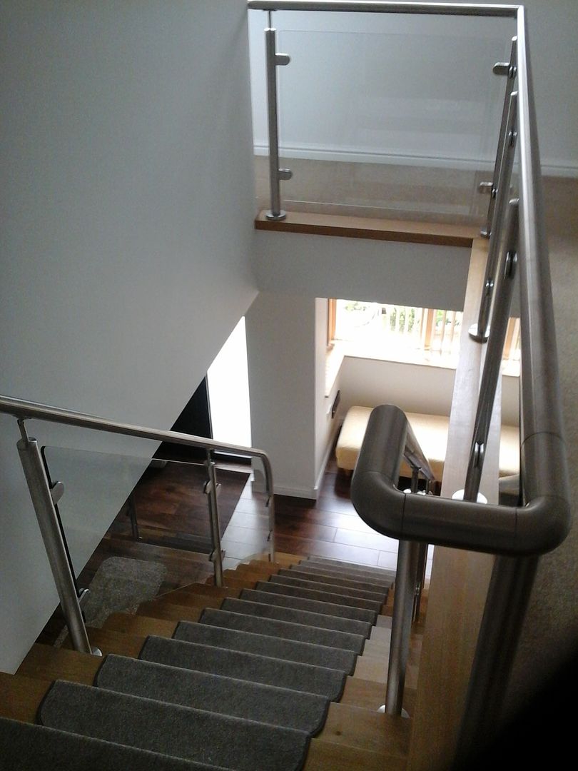 Stainless steel brushed handrails to internal staircase and landing
