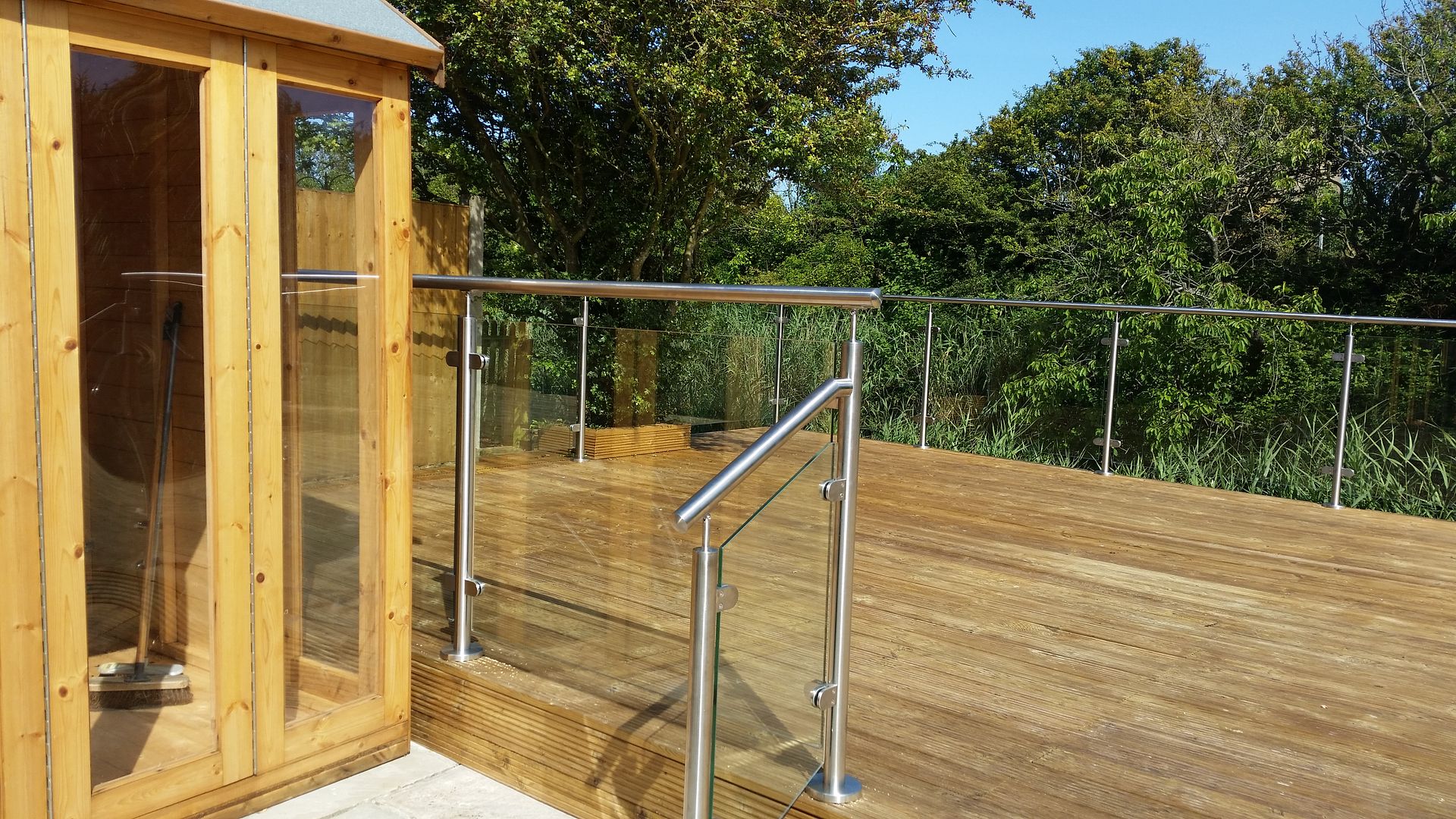 glass balustrade to decking base manufactured and installed