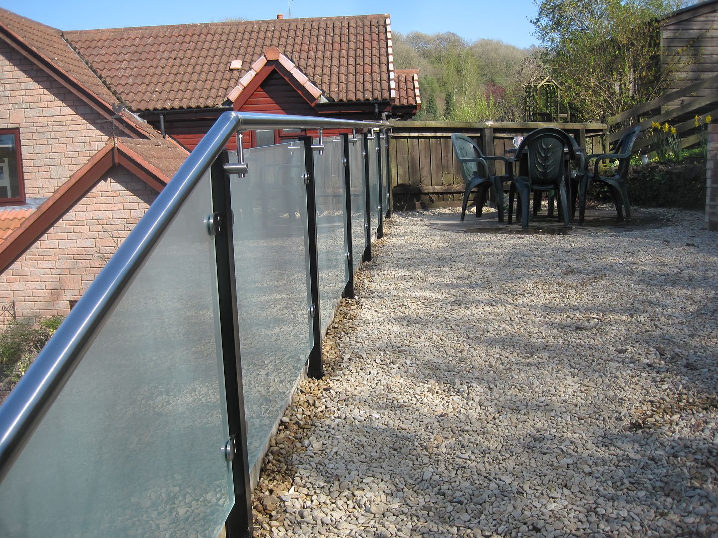 Modern glass balcony in midlands. Opaque frosted glass infills
