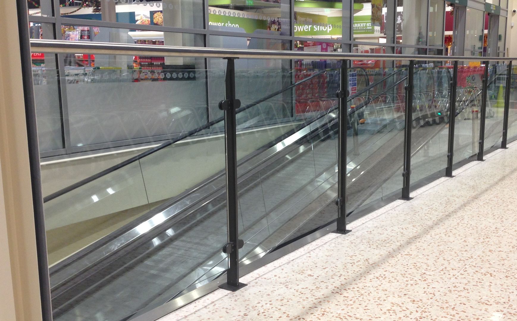 Stainless steel handrail with powdercoated posts - Glass balustrade online
