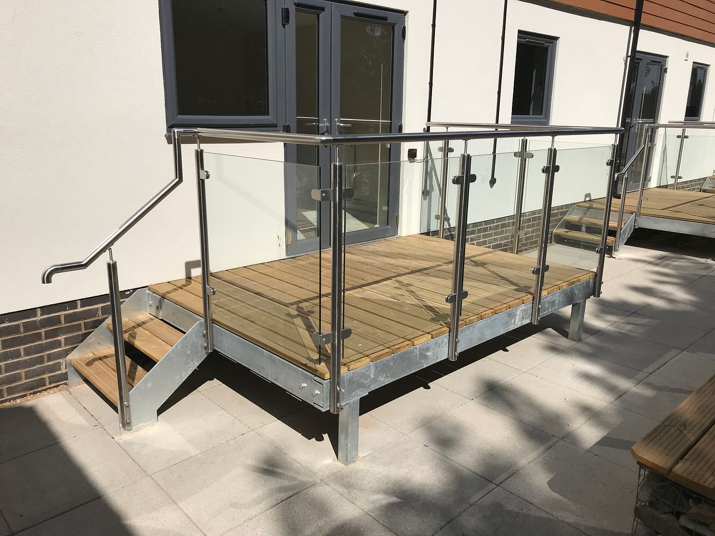 Metal balcony structure with decking