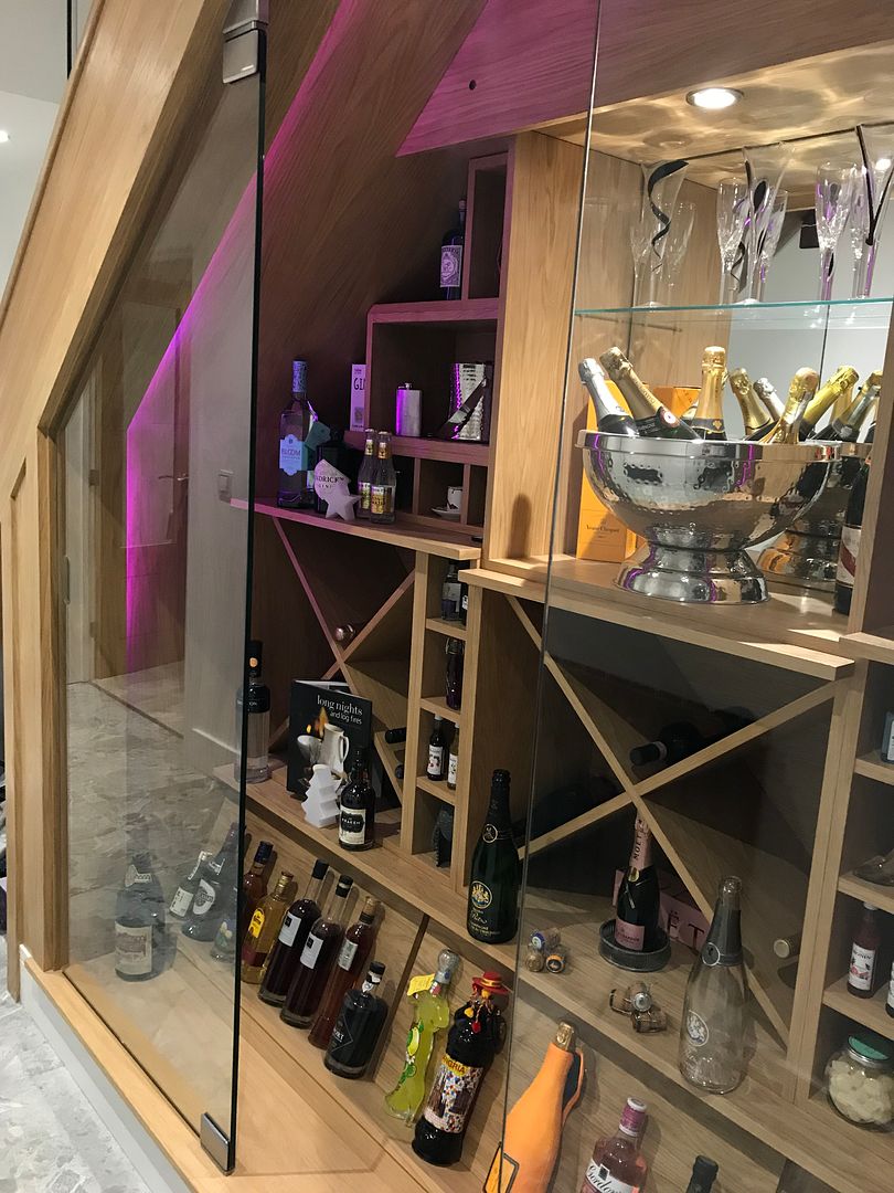 Glass door wine display understairs